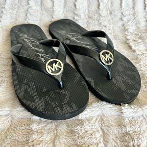 Black Michael Kors flip flops